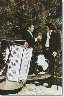 Elvis takes delivery of his first 1971 Stutz Blackhawk from Jules Meyers